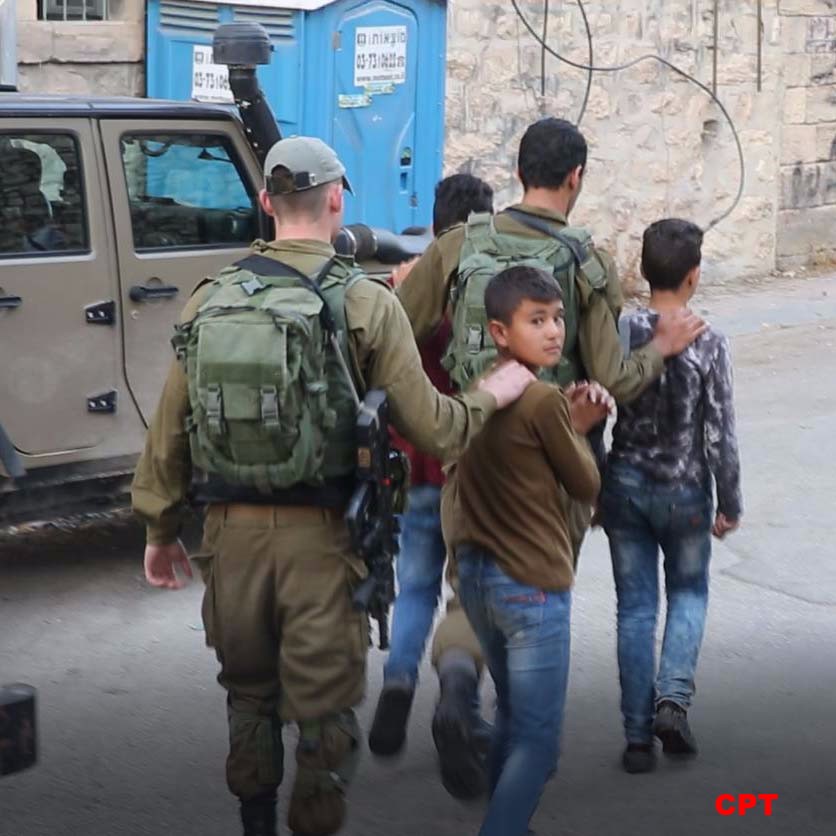  Israeli soldiers detain a Palestinian minor inside of Hebron's Old City on October 13, 2017. (Photo: Christian Peacemakers Team)