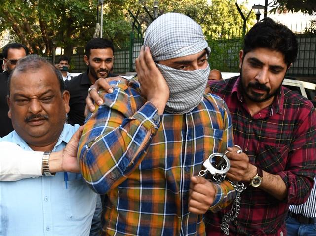 Shahrukh Pathan, who pointed a gun at a police officer during the North East Delhi riots